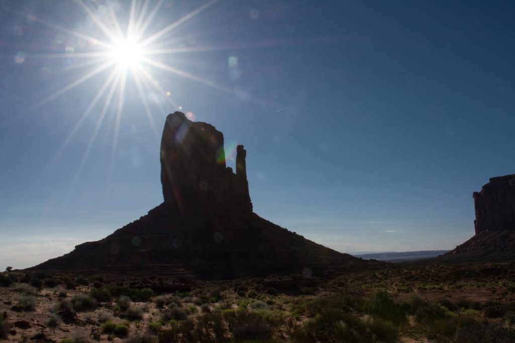 Sun rises behind west mitten butte