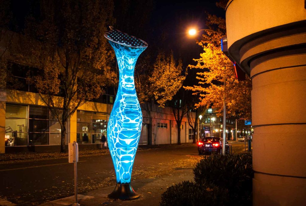 Portland carnivore street lamp blue at night.