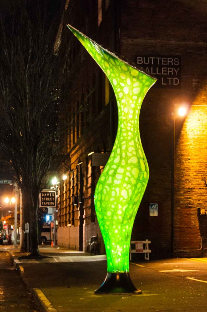 Carnivore street lamp in Portland at night green