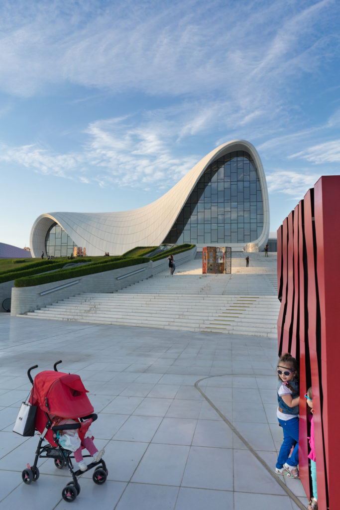 Children playing around the art in front of the Heydar Aliyev Cultural Center in Baku